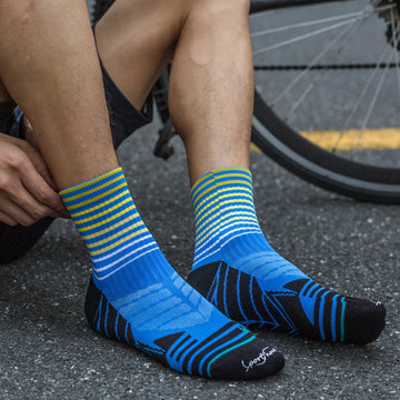 Calcetines para ciclismo azul de hombre con acolchado técnico por zonas y ajustes sin costuras.-Kylie Crazy